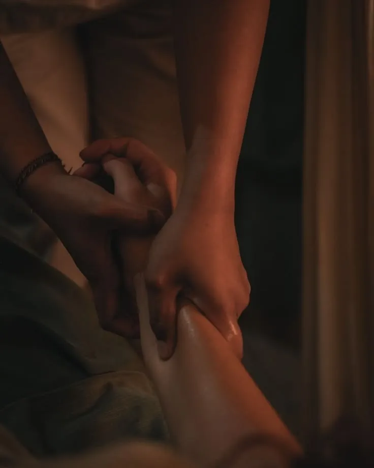 Four hand massage performed by two spa therapists
